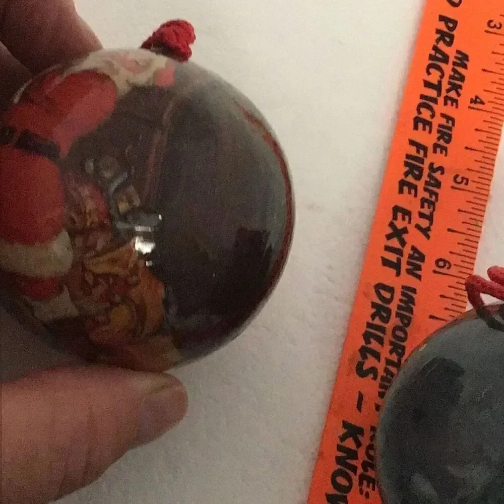 Pair of vintage paper ball Santa Christmas ornaments